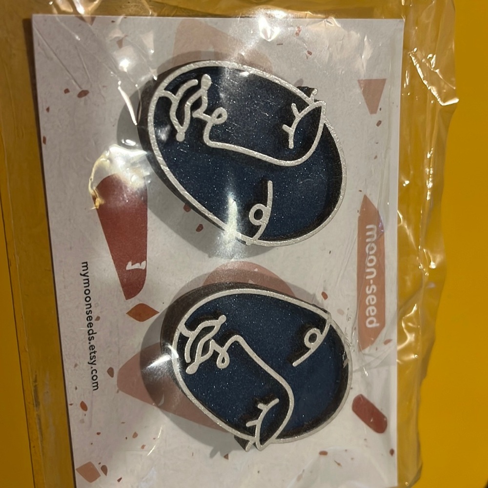 Moon-seed face earrings indie designer